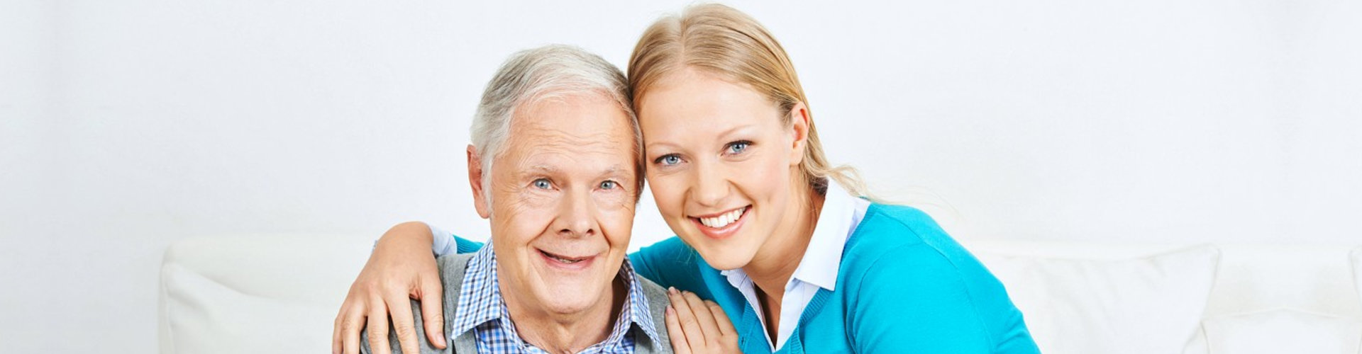 woman hugging senior man